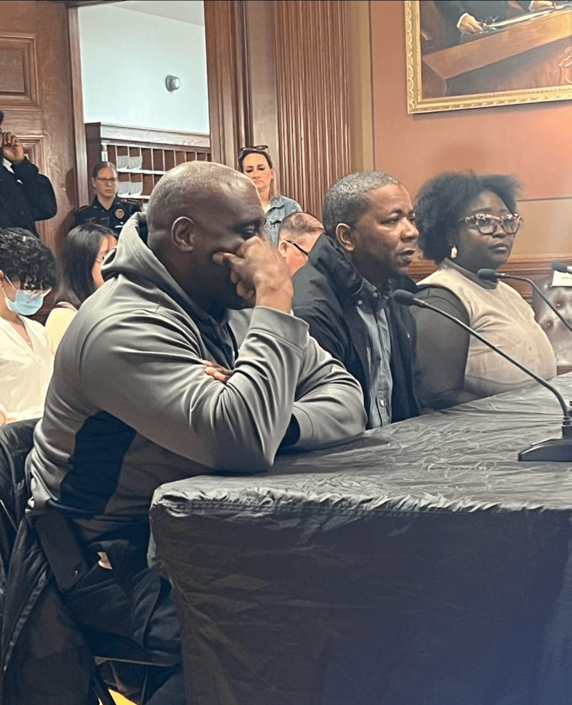 Lead By Example representatives testifying at a formal government hearing panel