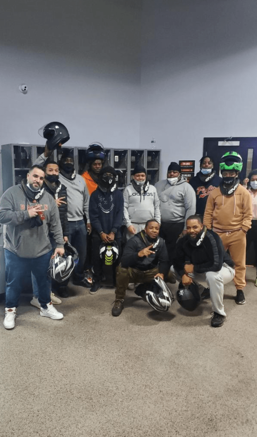 Lead By Example members gathered at a Ryder's community event in Providence